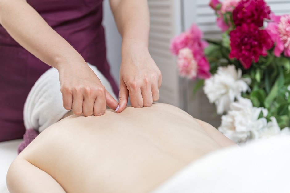 Women hands do therapeutic neck massage
