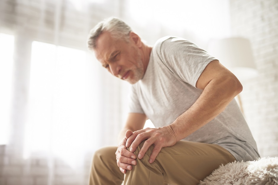 Retired Man Pensioner Suffering Knee Pain at Home.